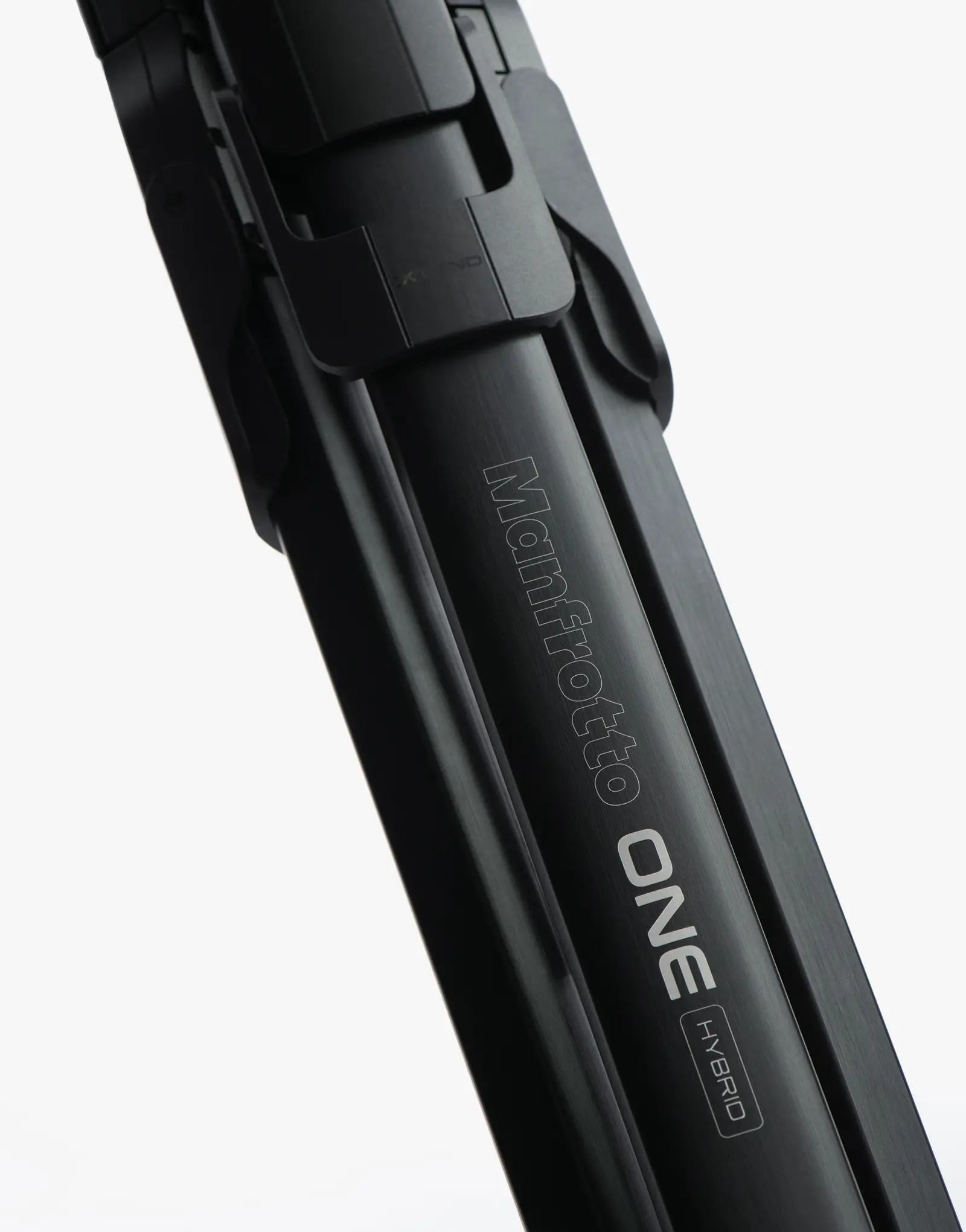 Close-up of the ONE tripod leg by leading industrial design consultancy LAYER showing the engraved wordmark on a white background.