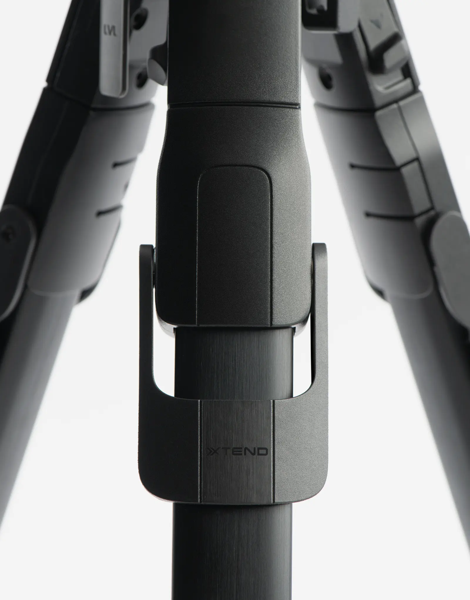 Close-up of the ONE tripod by leading industrial design consultancy LAYER showing the central locking mechanism and branding on a white background.
