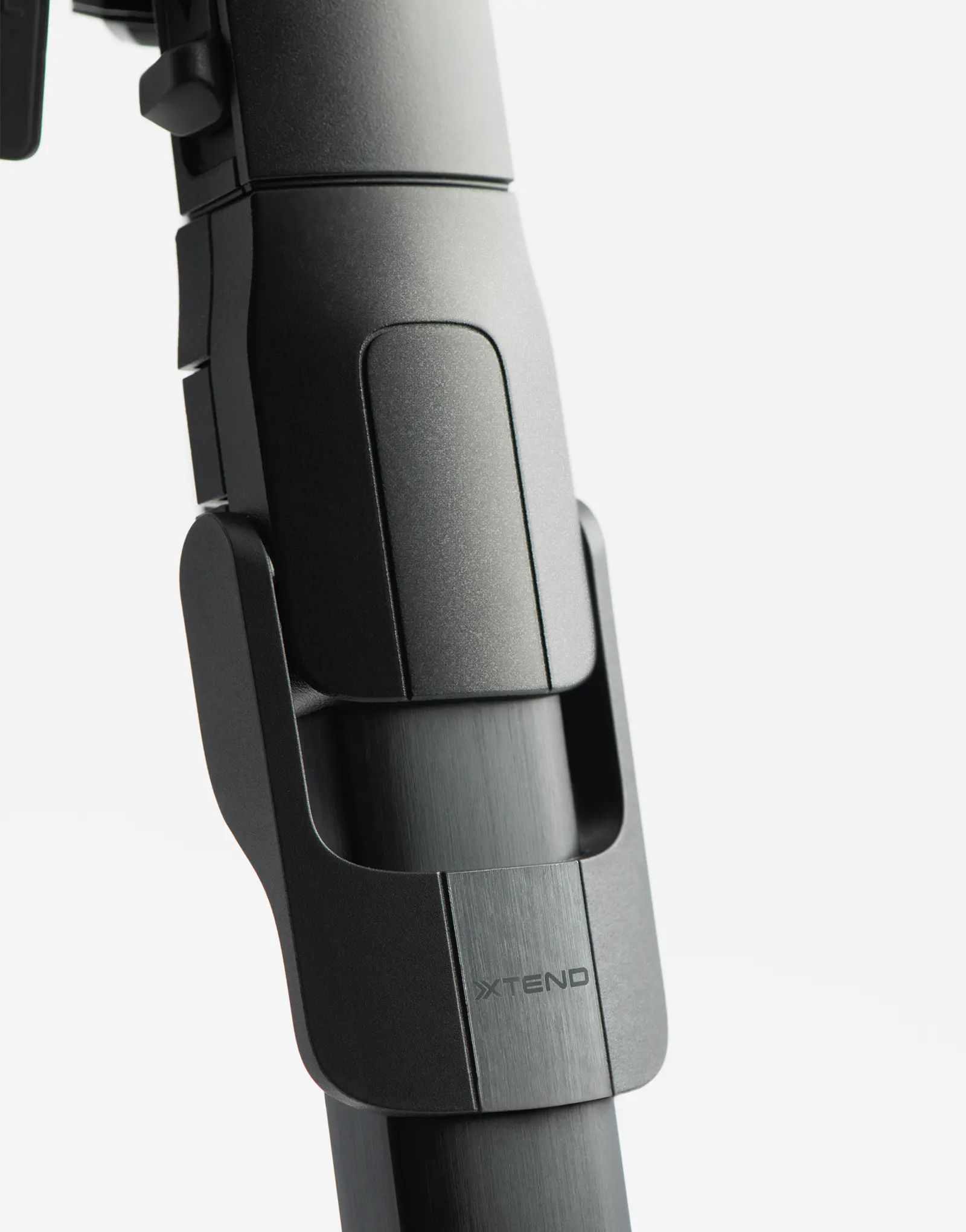 Close-up of the ONE tripod by leading industrial design consultancy LAYER showing the integrated locking mechanism on a white background.